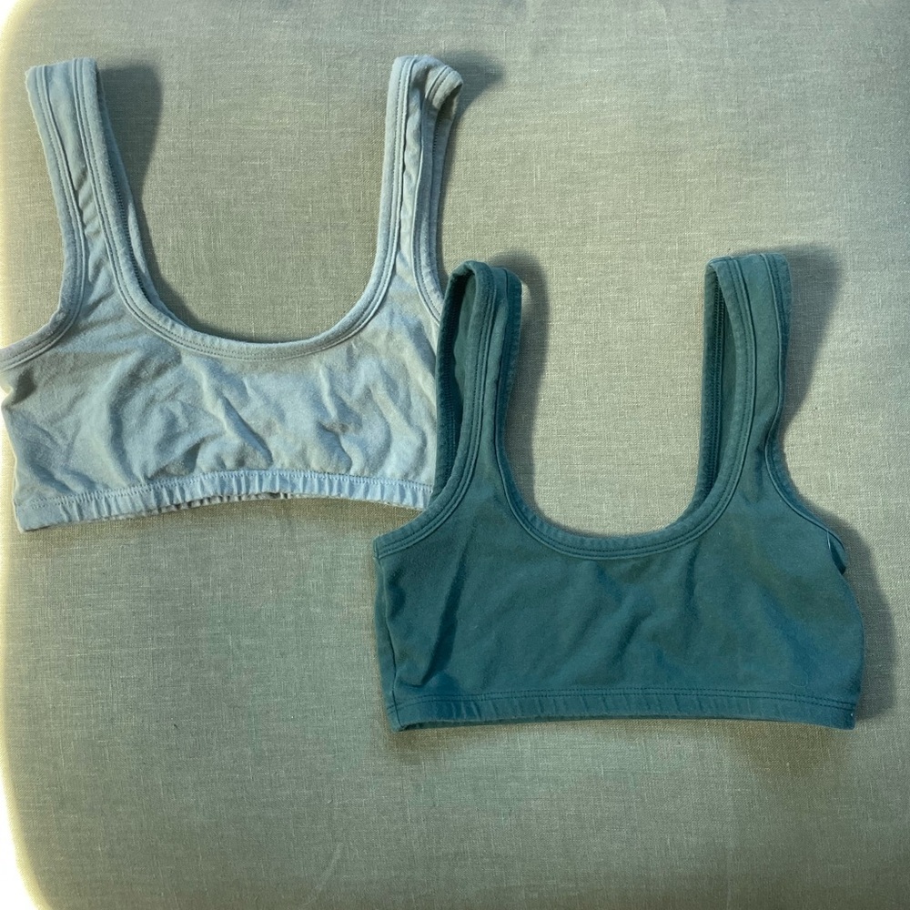 Two ARQ wide strap bras